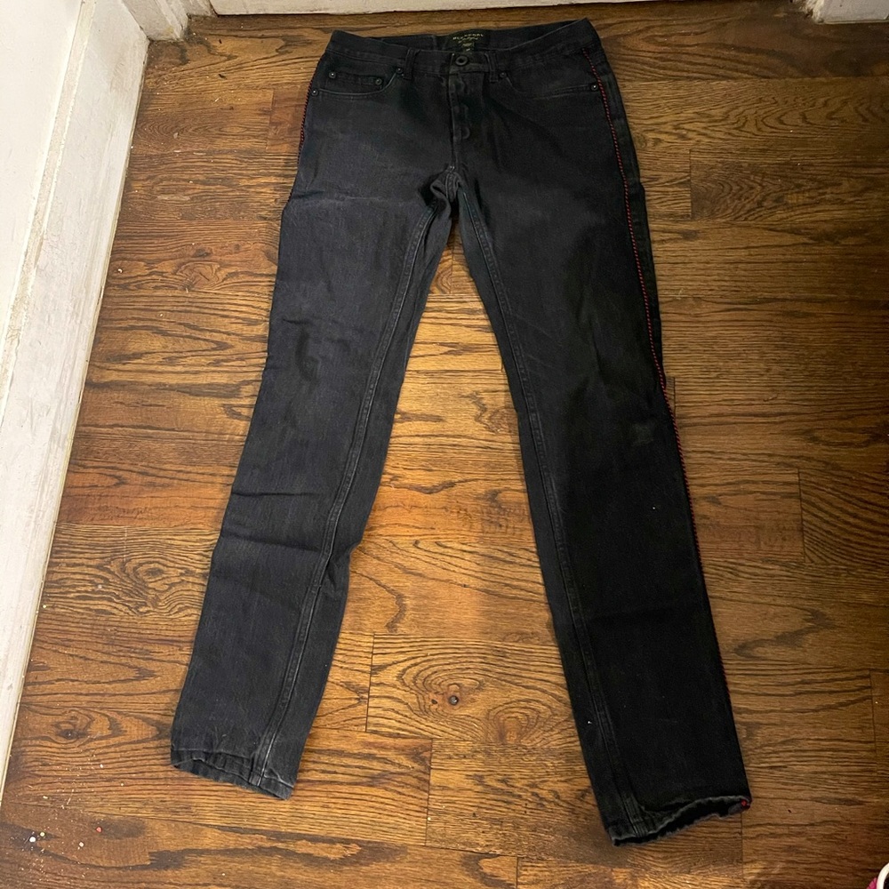Black jeans with red trim on the side
